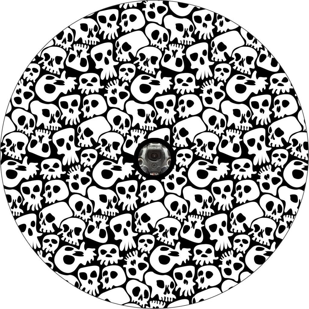 Fun and funky spooky skull spare tire cover pattern. Skulls covering the entire area of the black vinyl spare tire cover with JL back up camera design for wheels with back up cameras