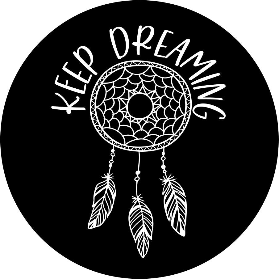 A dream catcher design with dangling feathers and the saying "keep dreaming" to protect you, absorb and discharge all of your bad dreams, and allow the good dreams to descend on to you!