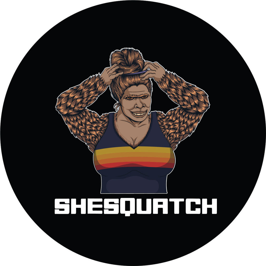 Shesquatch putting her hair in a top knot messy bun black vinyl custom spare tire cover