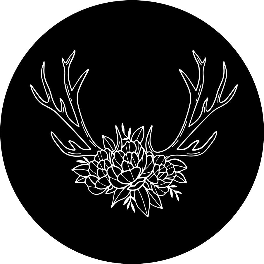 An outline image of deer antlers designed with floral bits and flowers for a spare tire cover