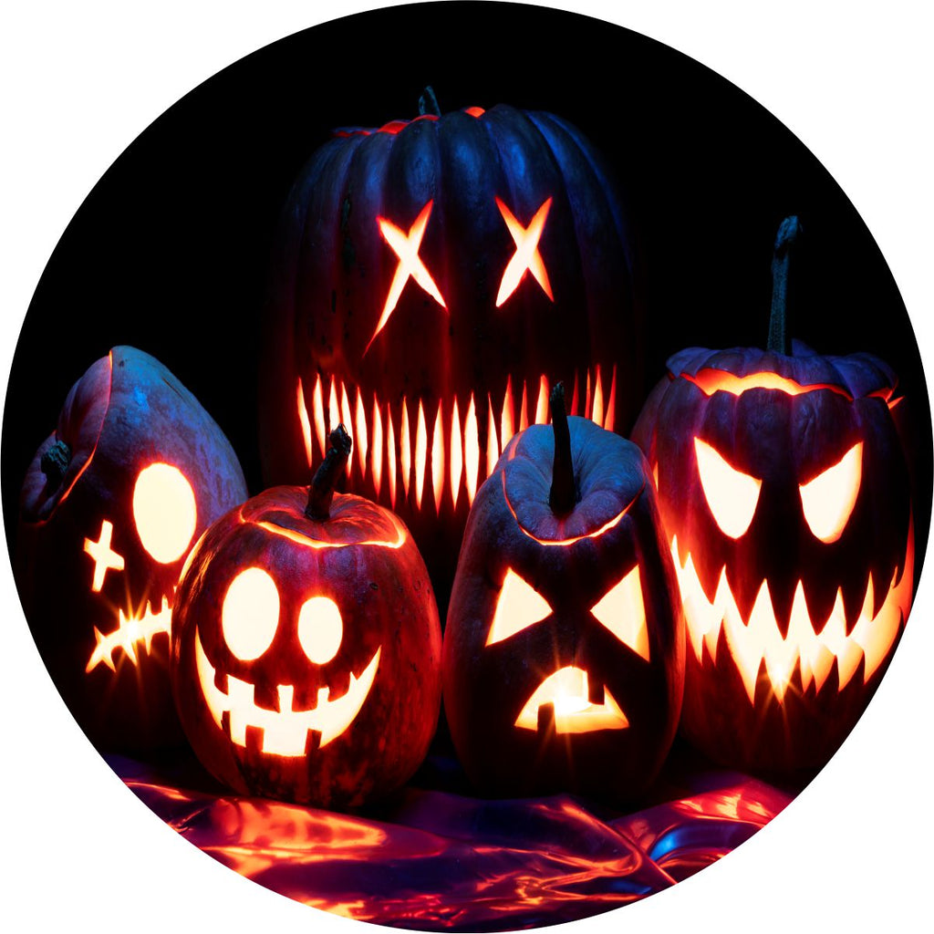 Spooky pumpkins and jack o lanterns with glowing faces in the dark image as a spare tire cover design