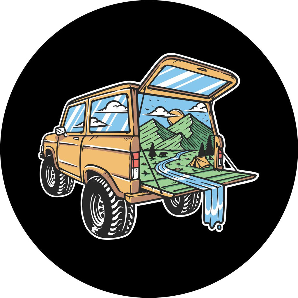 A creative and unique spare tire cover design with a Ford Bronco SUV and the mountains and outdoors beautiful camping scene coming out of the back. 
