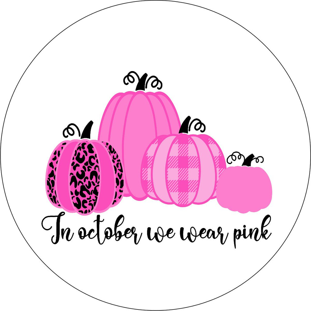 Four pink pumpkins designed with the saying in October we wear pink spare tire cover on white vinyl for Jeep, RV, Camper, Bronco and more