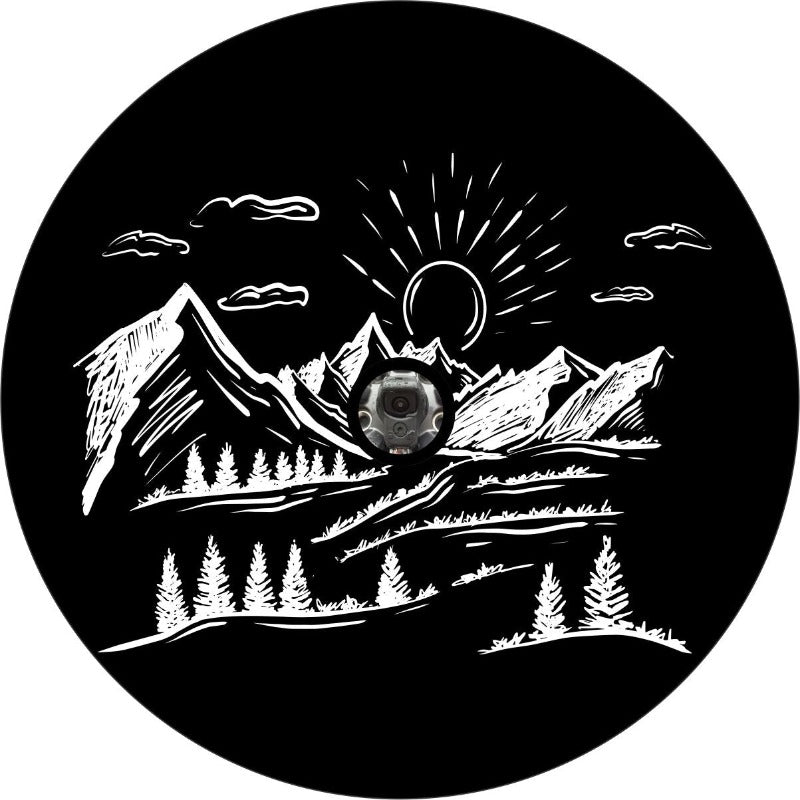 Hand sketched designed spare tire cover of mountains in the distance with the sun dropping in the background with a JL back up camera