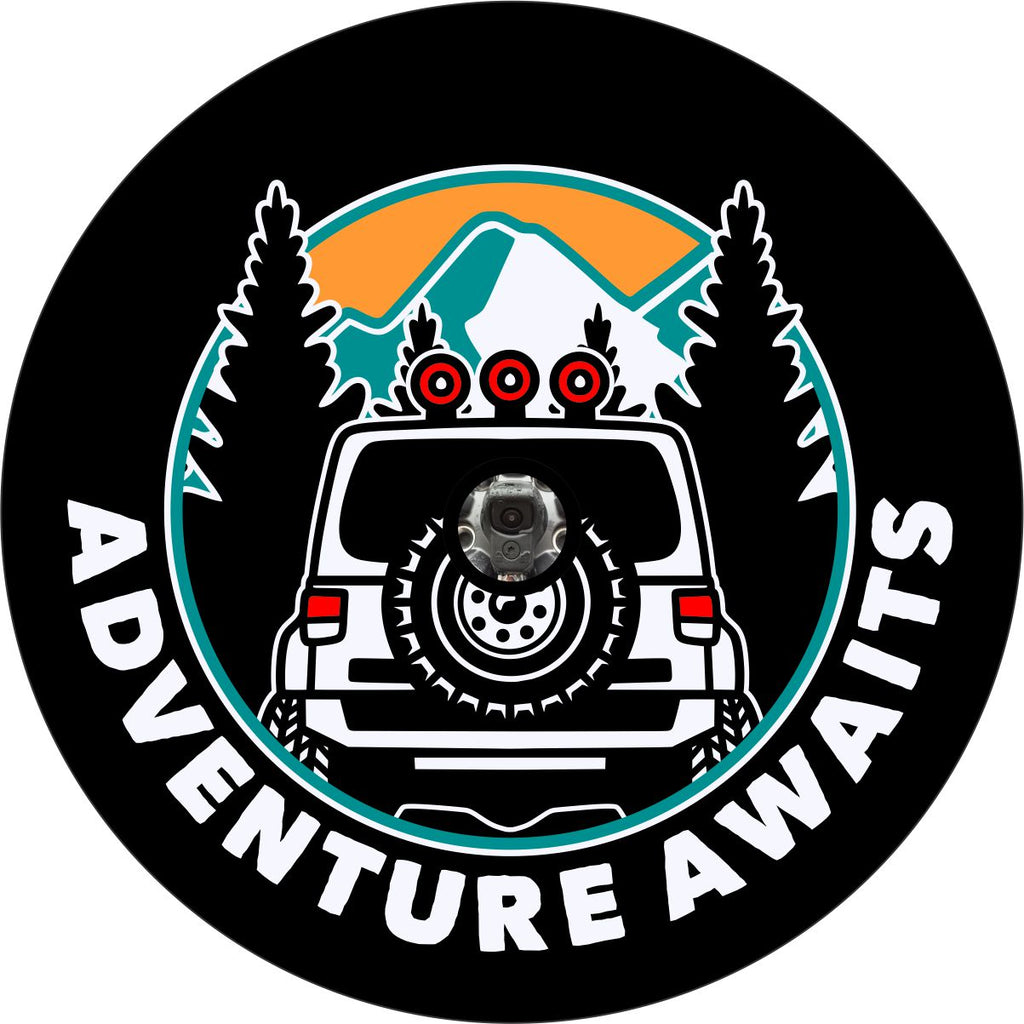 Spare tire cover design with a camera hole for back up cameras of the back side silhouette of a Jeep Wrangler driving into the mountains with the words adventure awaits below.