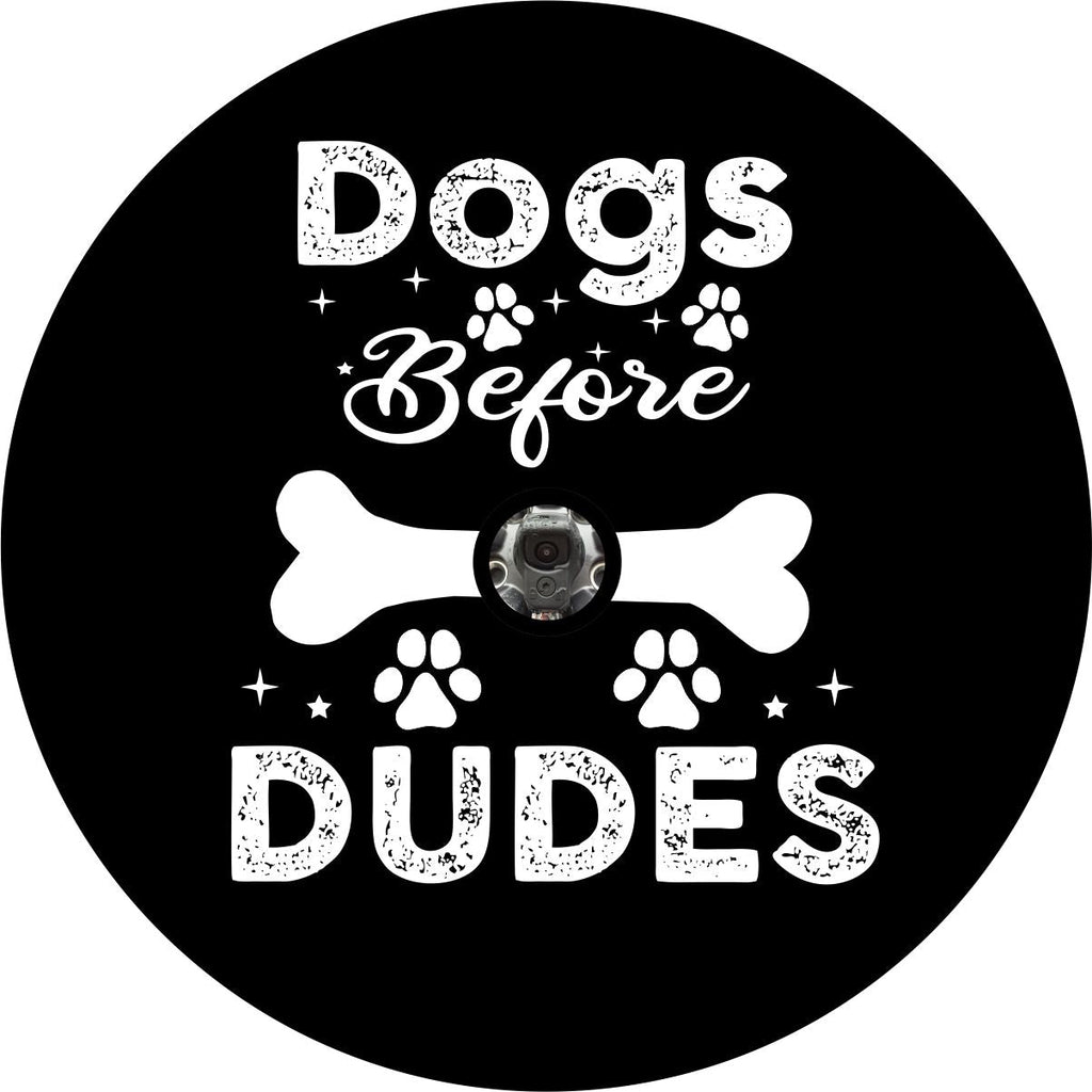 Cute and funny spare tire cover with the saying dogs before dudes and dog paw prints and a dog bone design. Made with a camera hole for backup camera.