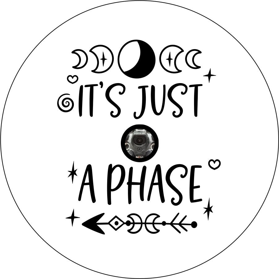 It's just a phase quote with moon and arrow design accents spare tire cover for Jeep, RV, Camper, and more on white vinyl with back up camera design.