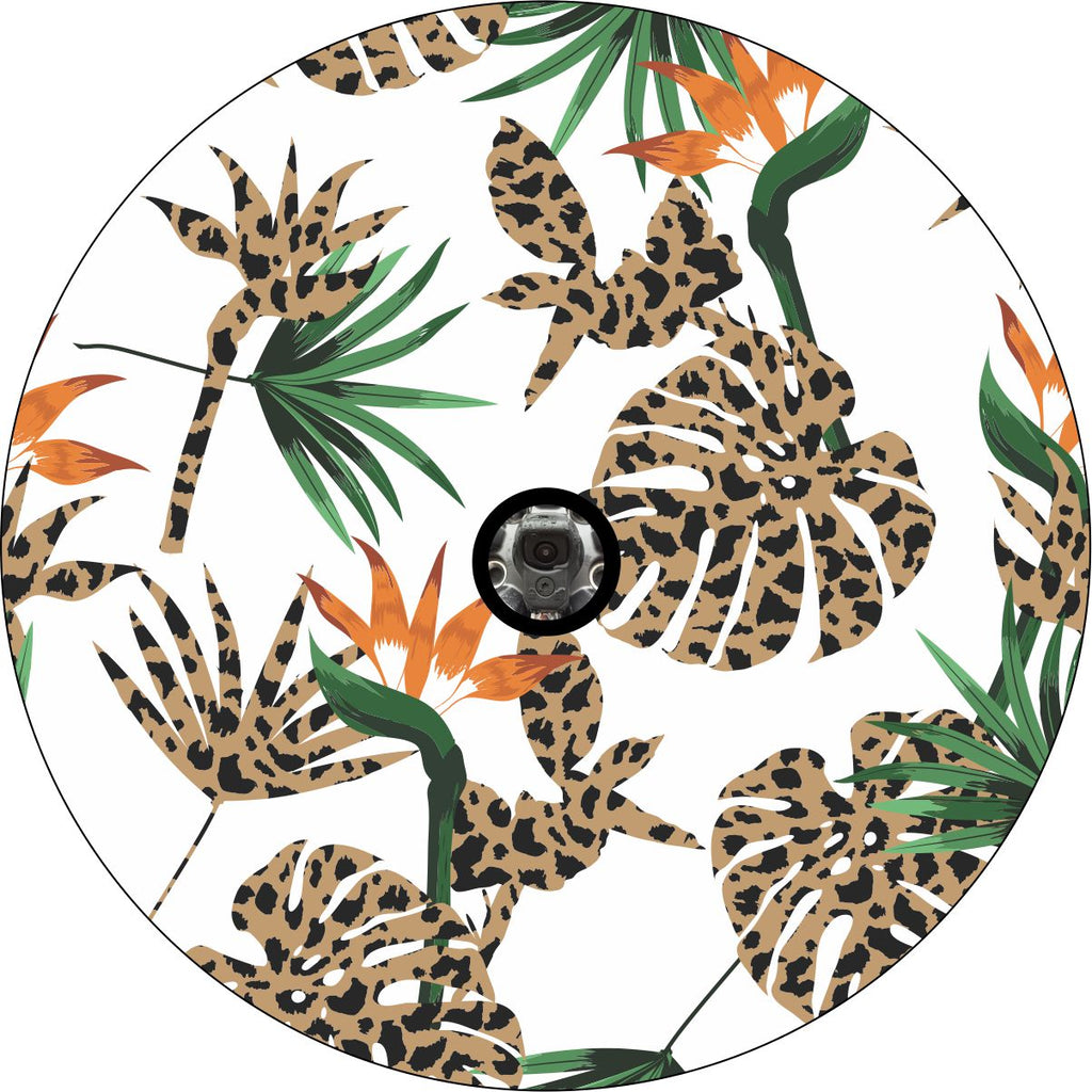 Prototype of a spare tire cover with bird of paradise flowers in the green and orange color plus leopard or cheetah print patterns with back up camera