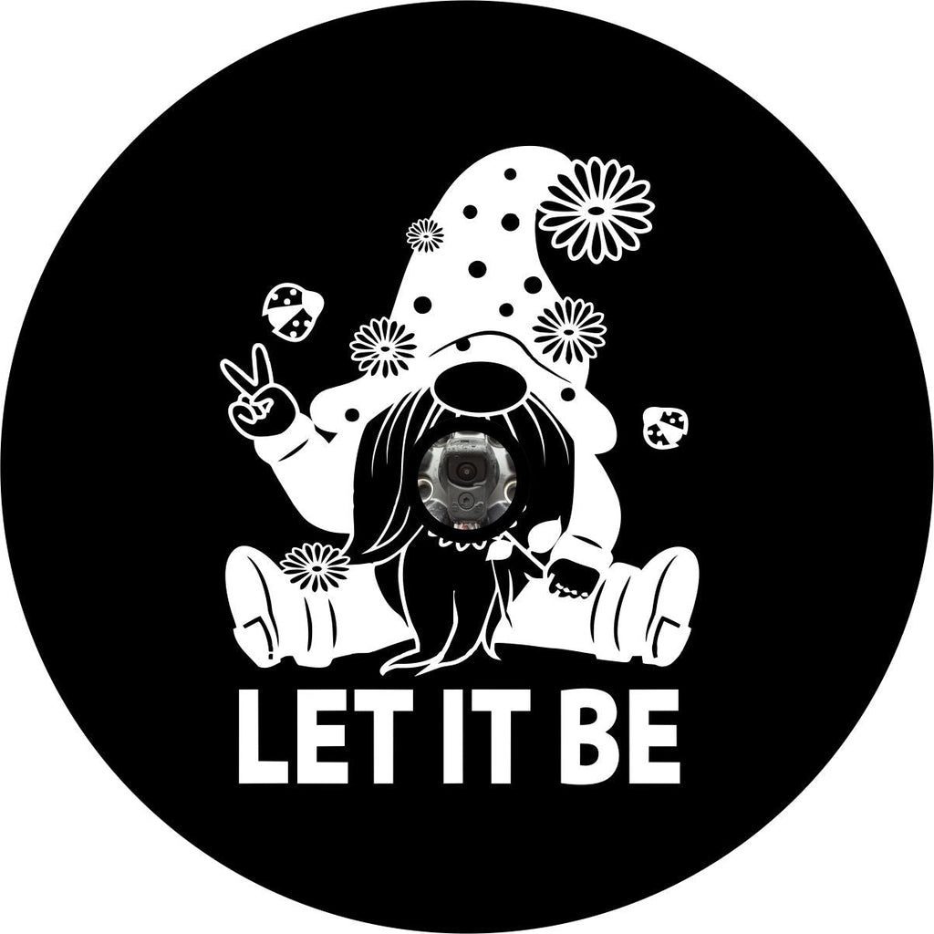 Black vinyl spare tire cover with back up camera of a white Scandinavian gnome sitting down with flowers and lady bugs giving a peace sign and the saying "let it be" below it. 