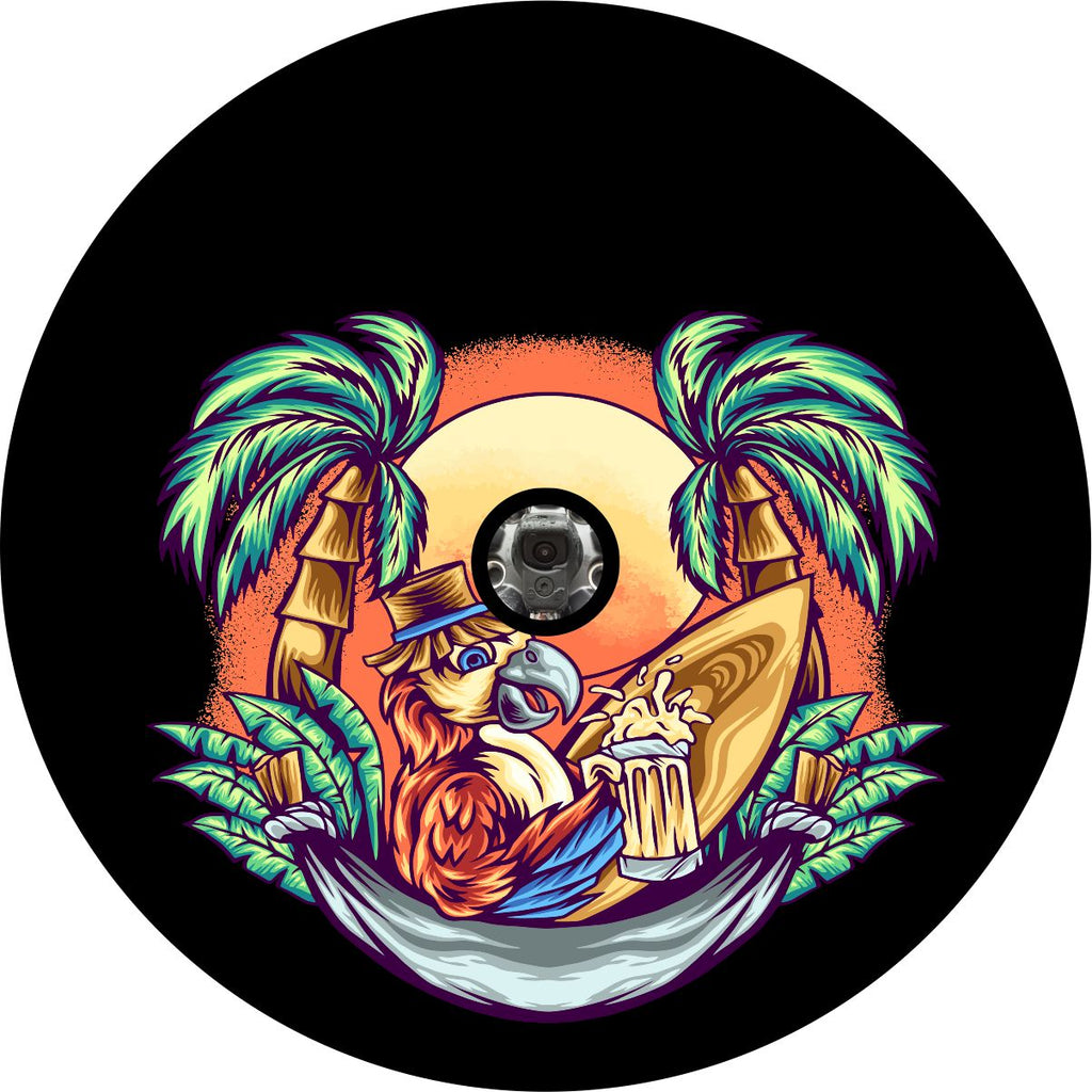 Spare tire cover with a camera hole for a back up camera of a parrot in a hammock drinking a beer, sitting next to his surfboard in between two palm trees at sunset at the beach.