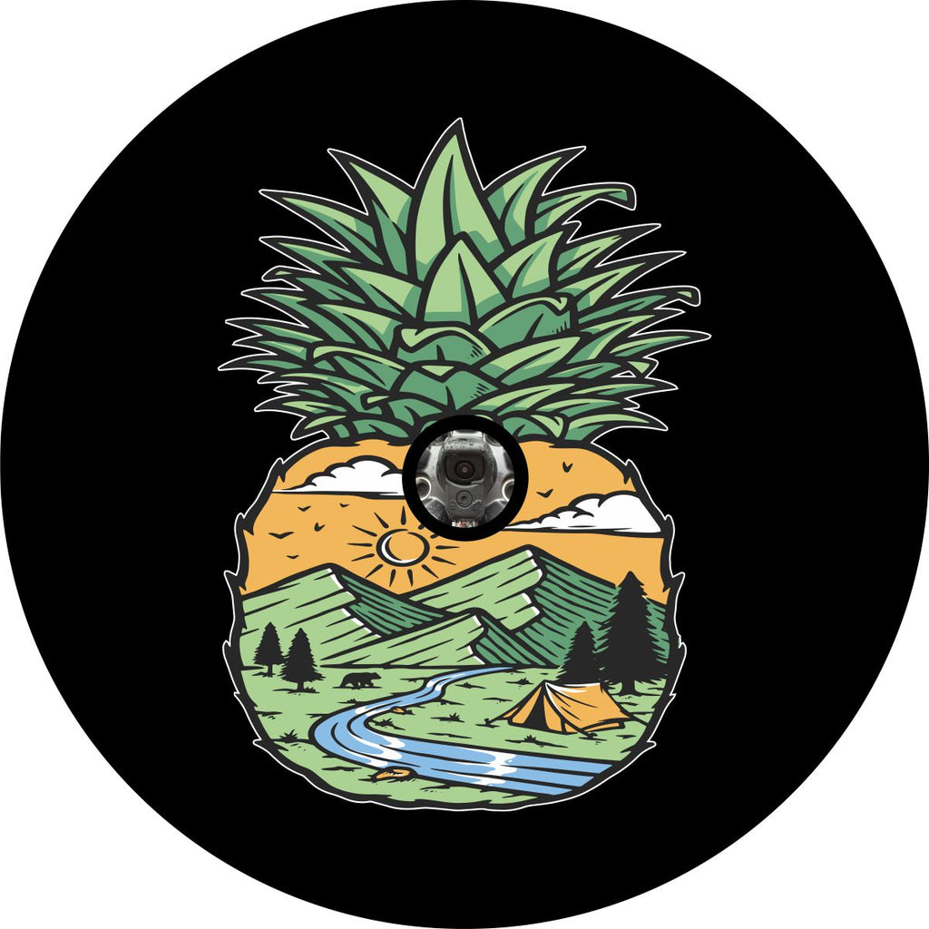 A bright and beautiful unique mountain scene inside a pineapple spare tire cover design with a space for a back up camera.