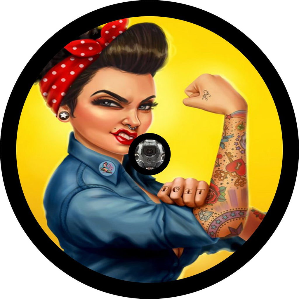 Yellow background fierce tattooed Rosie the Riveter spare tire cover custom made to order for any size vehicle including spare tire cover for Jeep, camper, Bronco, RV, FJ Cruiser, trailers, and more. Jeep spare tire cover design for camera hole