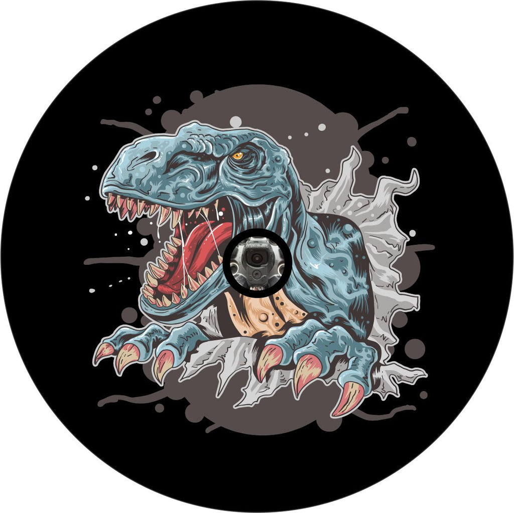 Tyrannosaurus rex clawing and climbing out of a spare tire cover creative design for a black vinyl spare tire. Great for Jeep, Bronco, RV, Trailers, Campers, and any other vehicle with a spare wheel that needs a hole for a back up camera.