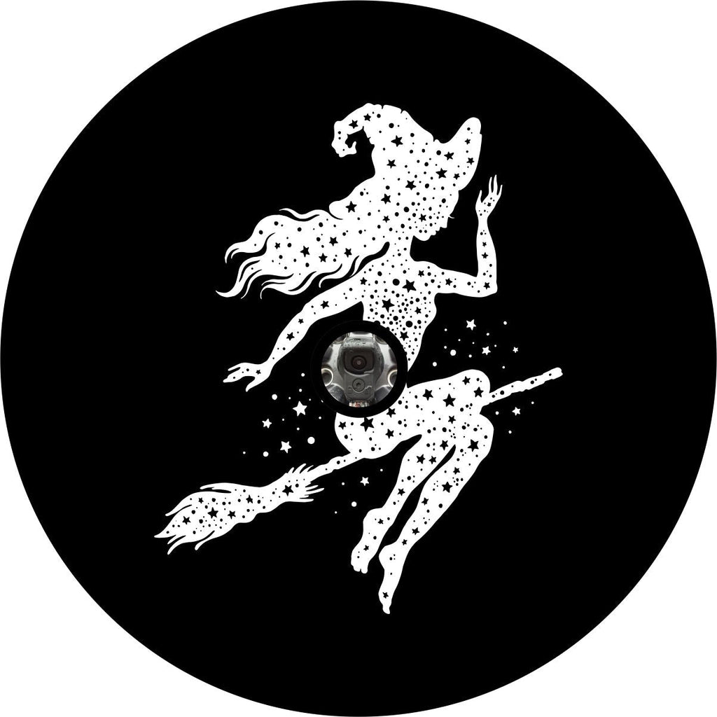 Stars fill the silhouette of a witch sitting upon and flying on a broom stick design spare tire cover for Jeep, Camper, RV, Bronco, Van, and more with a spare for your JL back up camera.