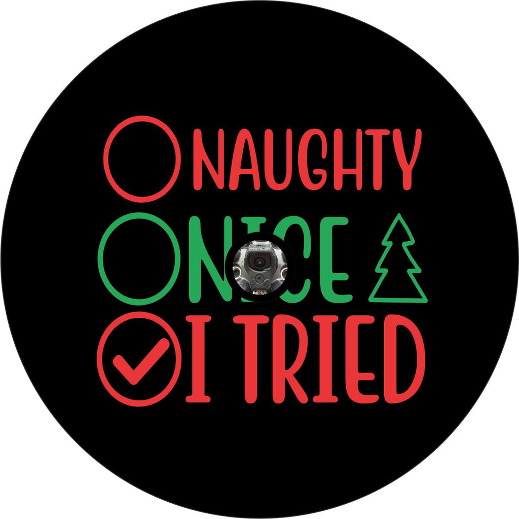 Black vinyl spare tire cover. Christmas spare tire cover design with red and green text and a checklist listing naughty, nice, I tried. Funny Christmas spare tire cover design with camera hole.