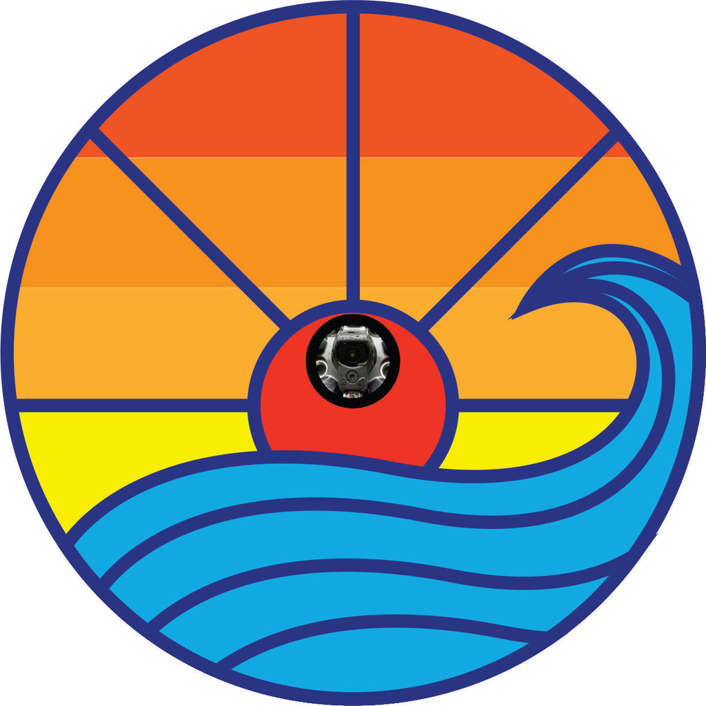 Bold geometric shapes and bright colors of orange and yellow with a wave of blue make up a spare tire cover beach ocean scene. Sunset on the horizon of the waves and ocean with a spare for a back up camera hole