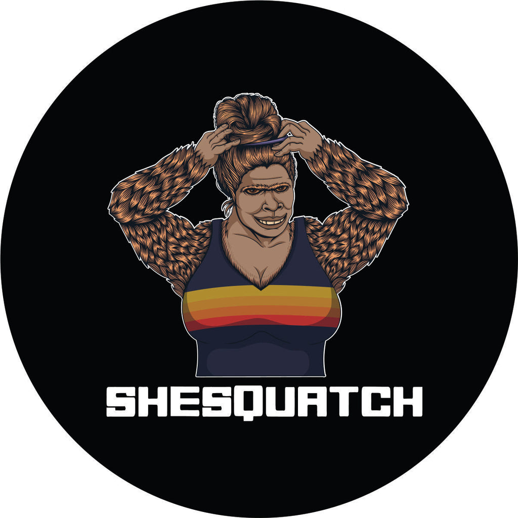 Shesquatch putting her hair in a top knot messy bun black vinyl custom spare tire cover 