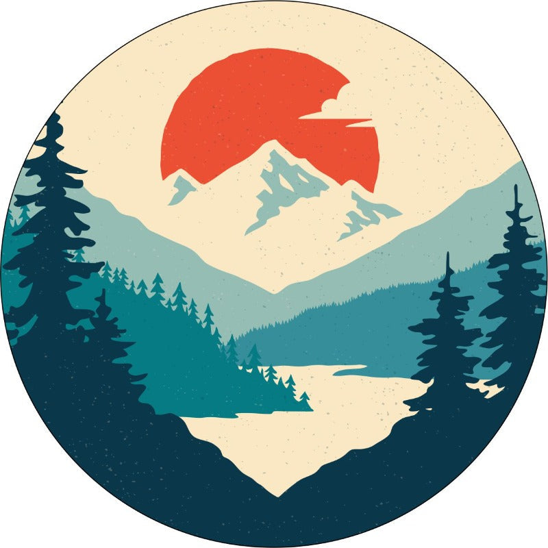 Prototype of a unique spare tire cover design with teal shades that make up a forest, river and mountain landscape with a bright orange sun dropping in the background.