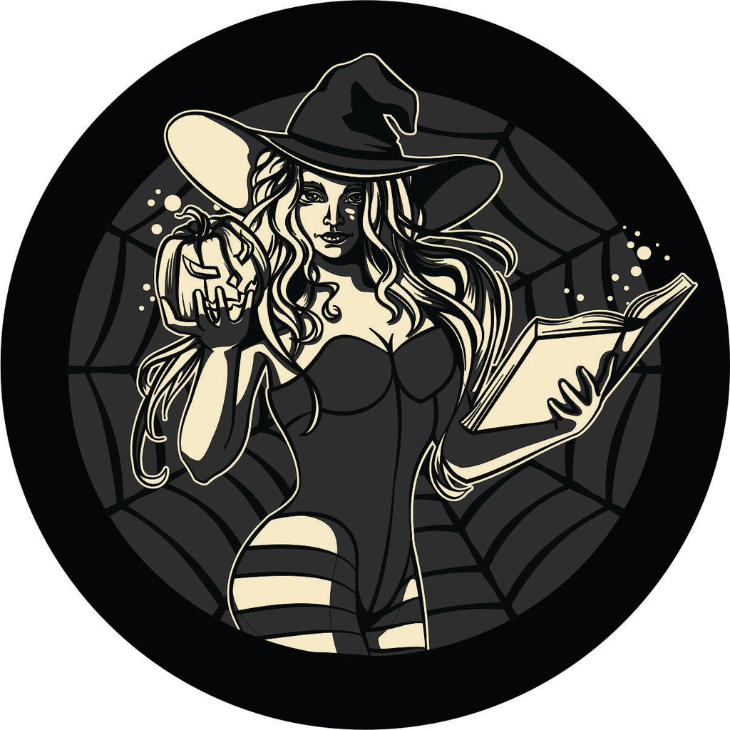 A spooky sexy graphic image of a witch in a corset and striped stockings holding a pumpkin and a book with a spider web in the back ground spare tire cover design