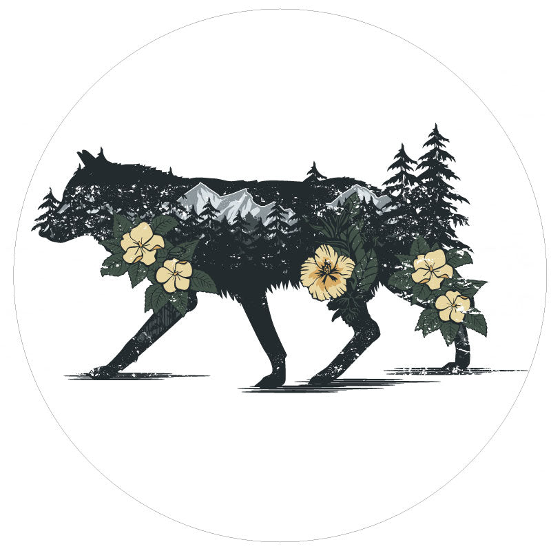 dark silhouette of a wolf unique spare tire cover design with the wild wilderness mountains, trees and flowers double exposed inside the wolf