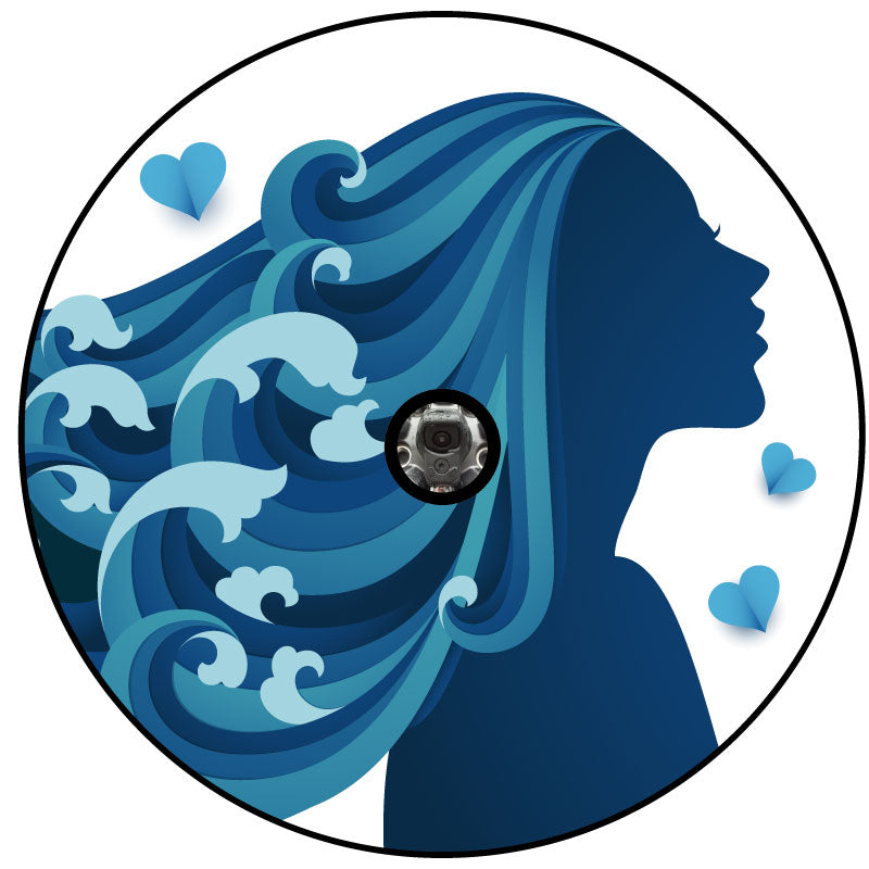 Unique spare tire cover design on white vinyl of a silhouette of a woman in the colors teal and blue with long flowing beautiful hair that looks like the ocean and waves crashing with a back up camera