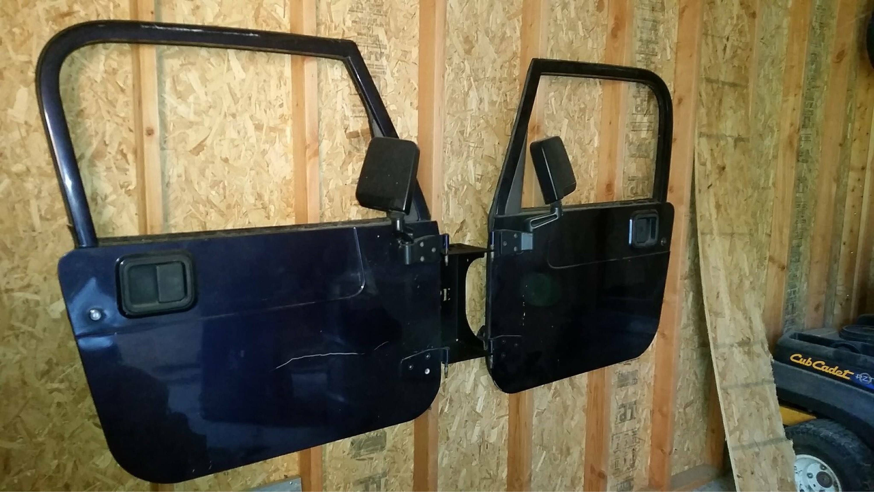Wall mounted Jeep door hanger. Single door holder holds 2 doors