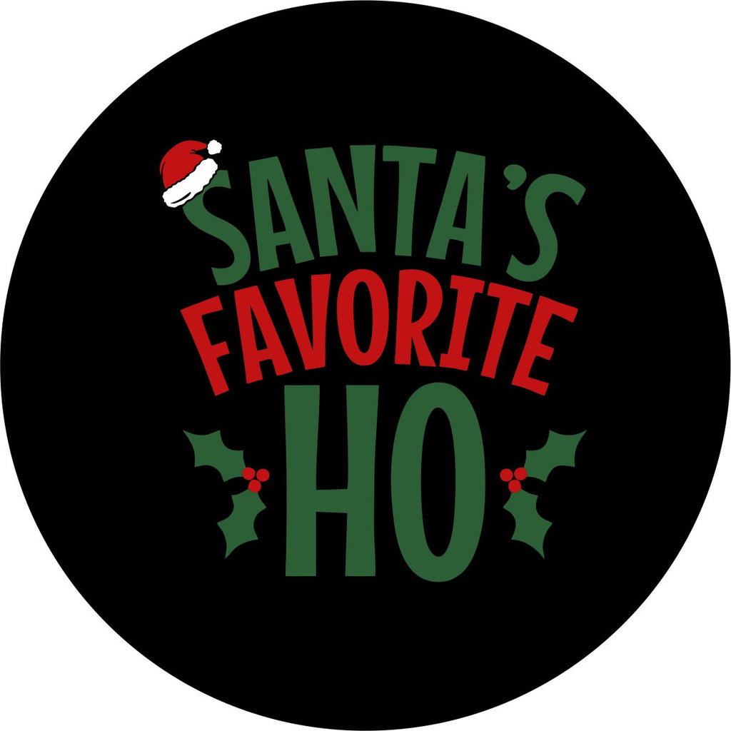 Black vinyl funny spare tire cover design in green and red letters saying Santa's Favorite Ho, with a Santa hat and holly berries Christmas theme design.